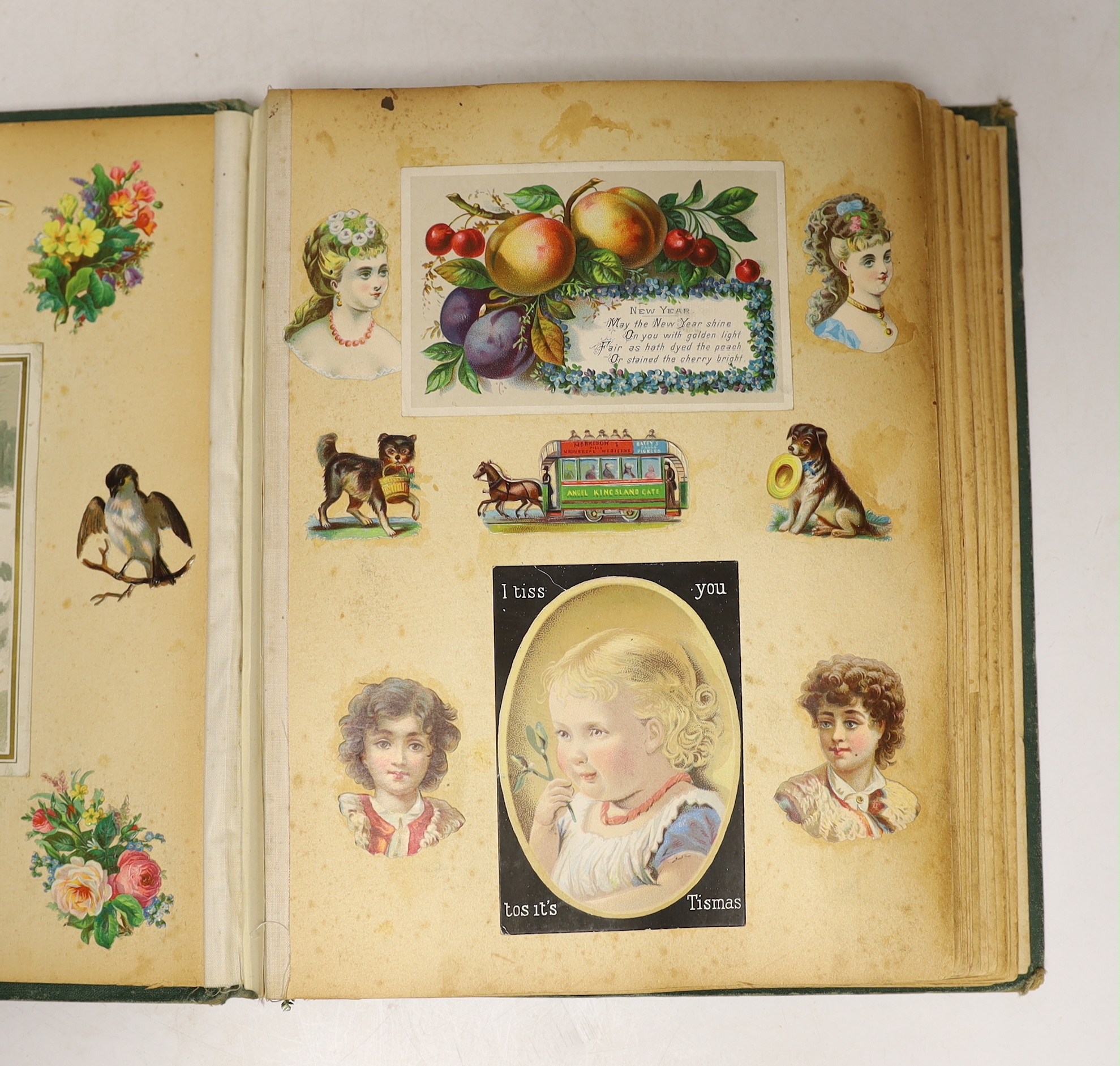 A Victorian scrap album, containing chromolithographic cards and scraps and pressed leaves and two other items